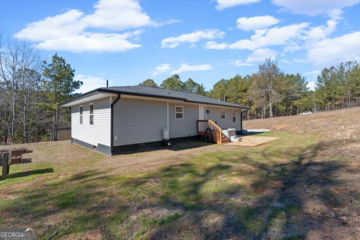 80 Hand Road Bowdon, GA 30108 - Photo 74 of 82 a view of a house with a backyard