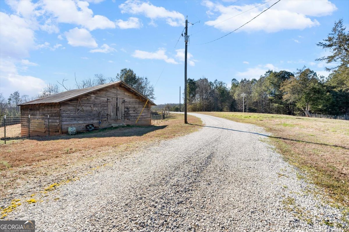 80 Hand Road Bowdon, GA 30108 - Photo 78 of 82 a house with trees in the background