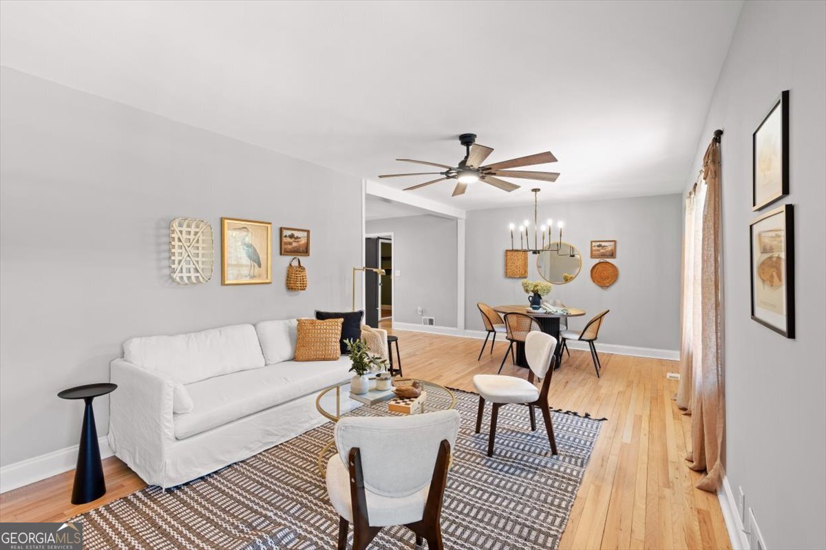 80 Hand Road Bowdon, GA 30108 - Photo 8 of 82 a living room with furniture a ceiling fan and a rug