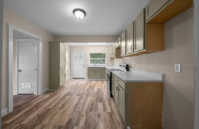 a view of a room with wooden floor and closet