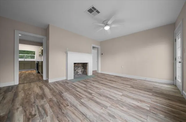 a view of an empty room with a window