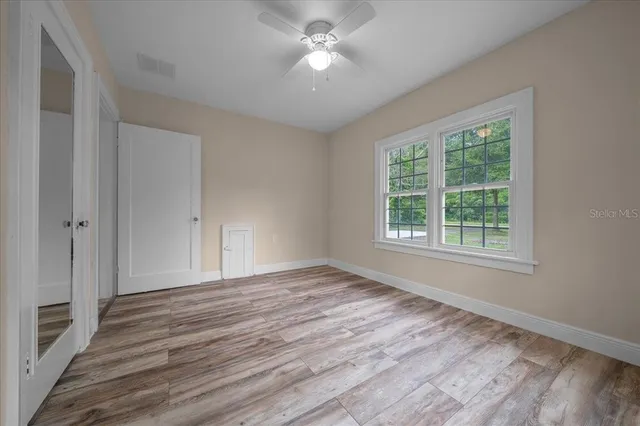 a view of a house with yard and a garden