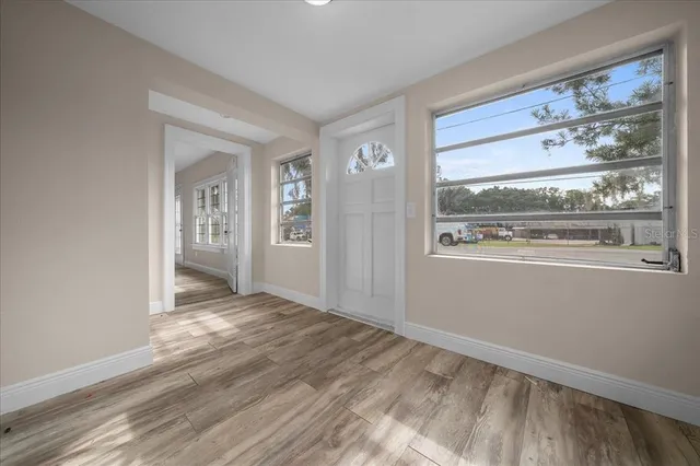 a view of a house with yard and a garden