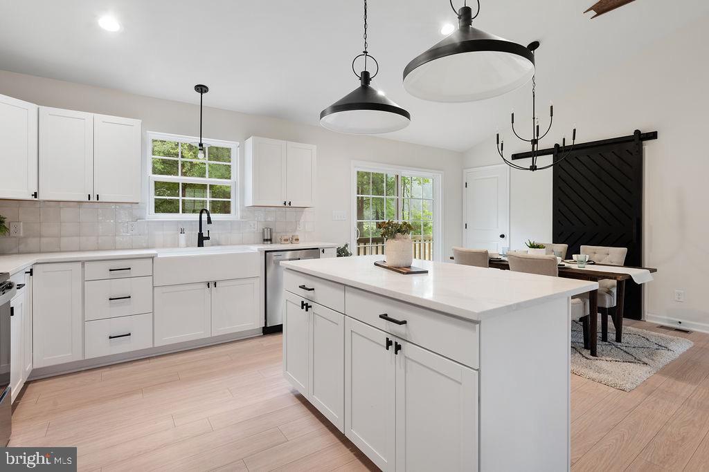 26332 Old Pitts Road Ruther Glen, VA 22546 - Photo 11 of 35 a kitchen with a sink stove and cabinets