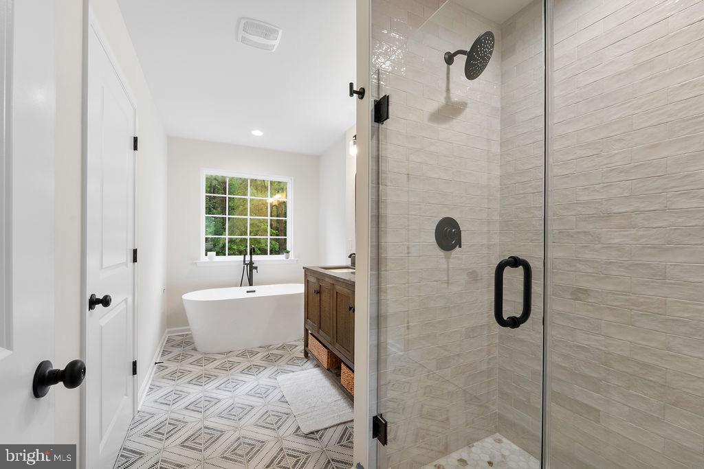 26332 Old Pitts Road Ruther Glen, VA 22546 - Photo 16 of 35 a bathroom with a bathtub and shower