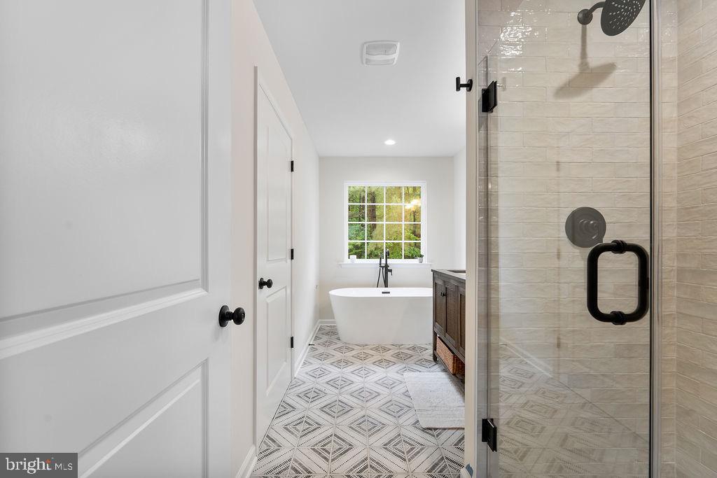 26332 Old Pitts Road Ruther Glen, VA 22546 - Photo 17 of 35 a bathroom with a granite countertop shower and a sink