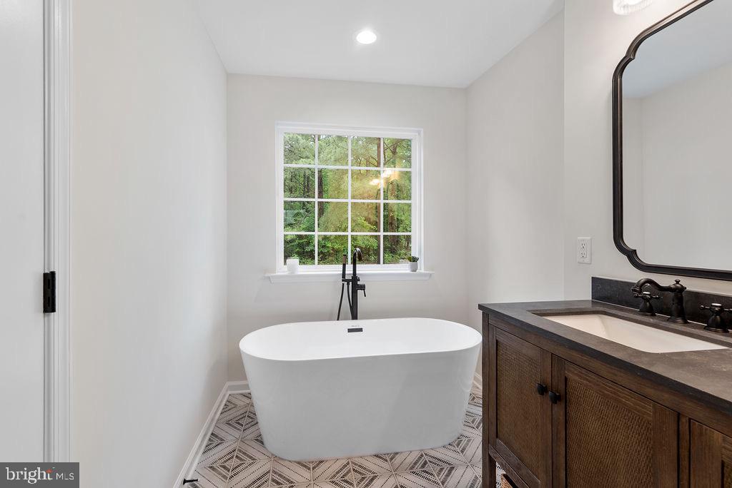 26332 Old Pitts Road Ruther Glen, VA 22546 - Photo 18 of 35 a bathroom with a sink and a mirror