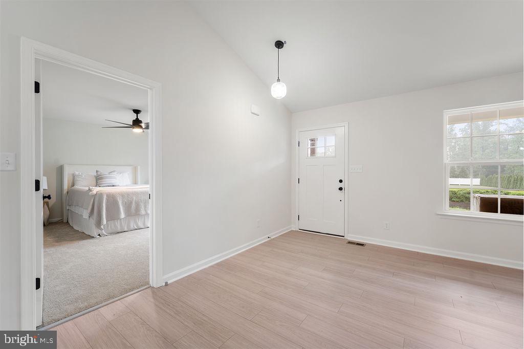 26332 Old Pitts Road Ruther Glen, VA 22546 - Photo 23 of 35 a view of a livingroom with a hall and a window