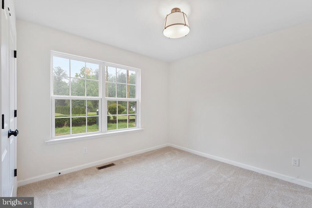 26332 Old Pitts Road Ruther Glen, VA 22546 - Photo 24 of 35 an empty room with a window