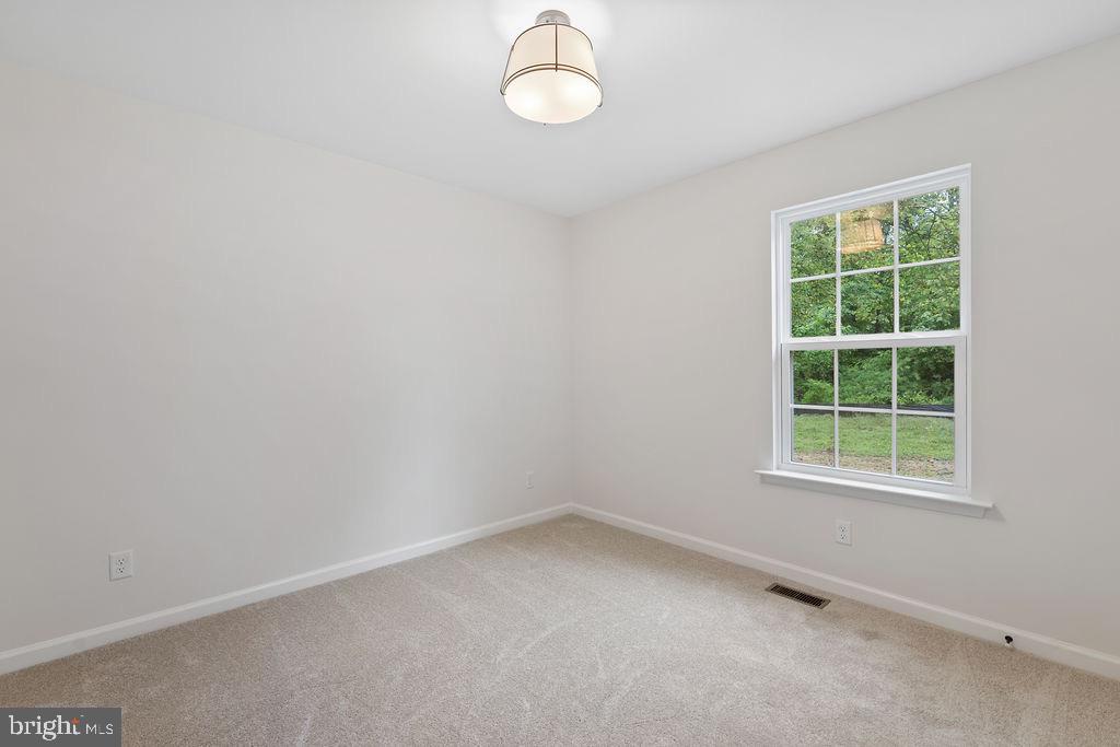 26332 Old Pitts Road Ruther Glen, VA 22546 - Photo 25 of 35 an empty room with a window