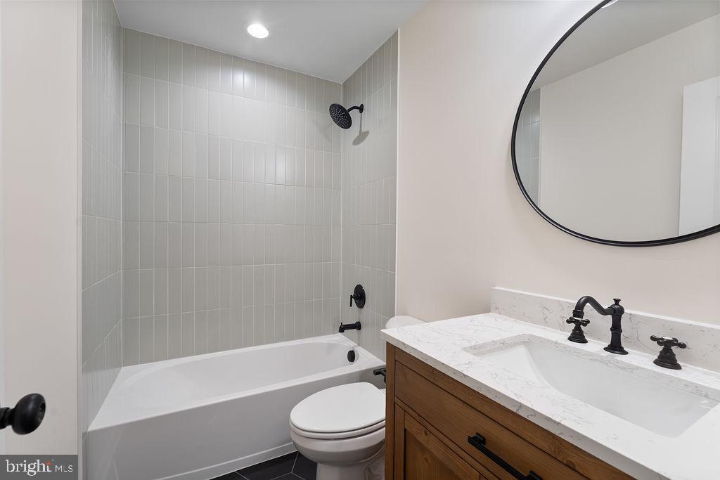 26332 Old Pitts Road Ruther Glen, VA 22546 - Photo 28 of 35 a bathroom with a sink a toilet and a mirror