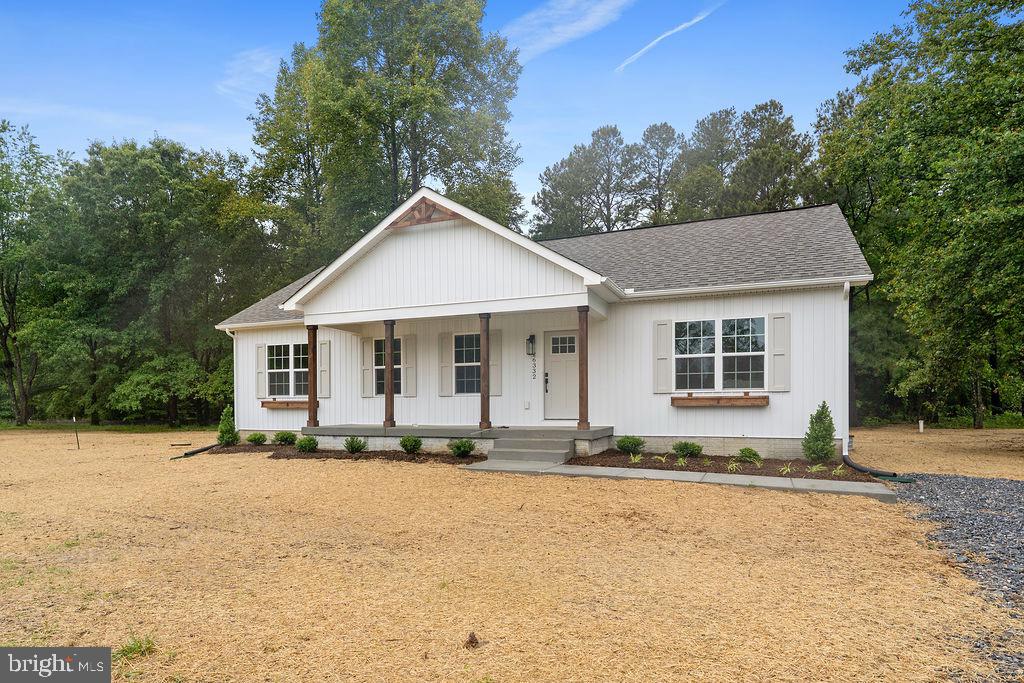 26332 Old Pitts Road Ruther Glen, VA 22546 - Photo 29 of 35 a front view of a house with a yard