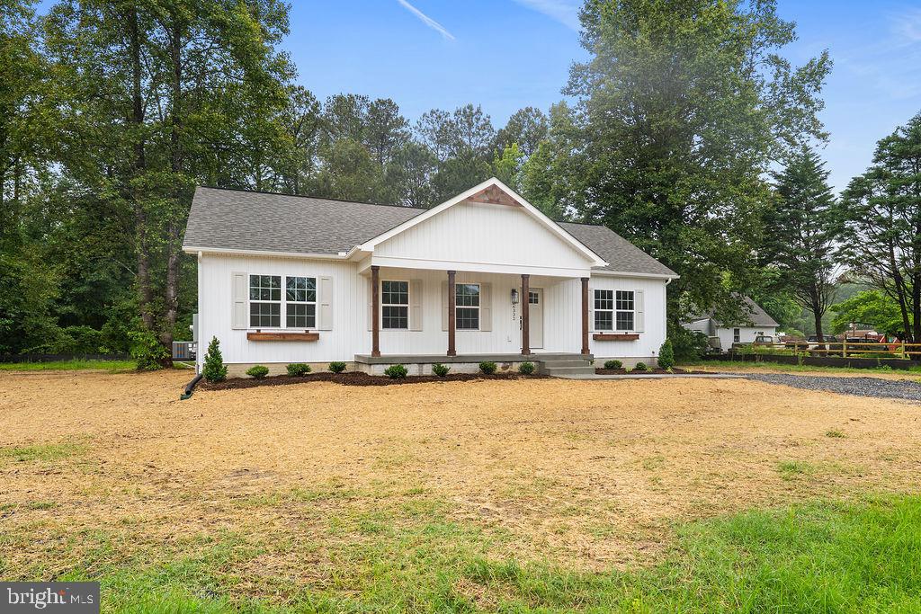 26332 Old Pitts Road Ruther Glen, VA 22546 - Photo 30 of 35 a front view of a house with a yard