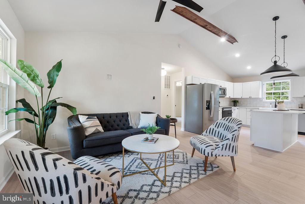26332 Old Pitts Road Ruther Glen, VA 22546 - Photo 3 of 35 a living room with furniture potted plant and a chandelier
