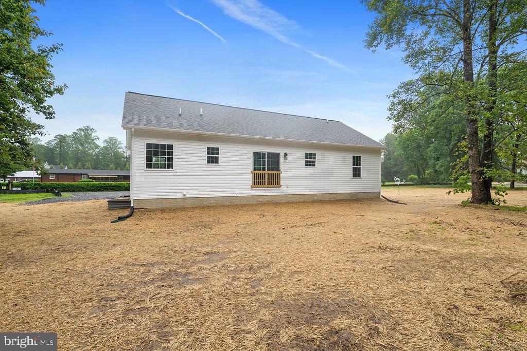 26332 Old Pitts Road Ruther Glen, VA 22546 - Photo 31 of 35 a view of a house with backyard and trees