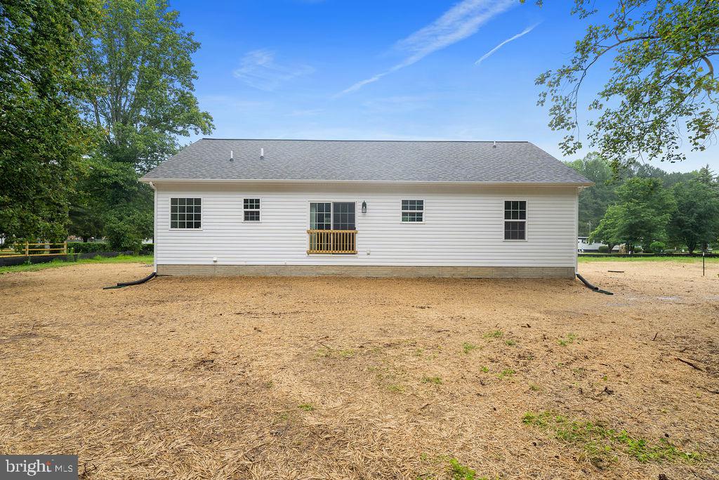 26332 Old Pitts Road Ruther Glen, VA 22546 - Photo 32 of 35 a view of house with backyard space and wooden fence