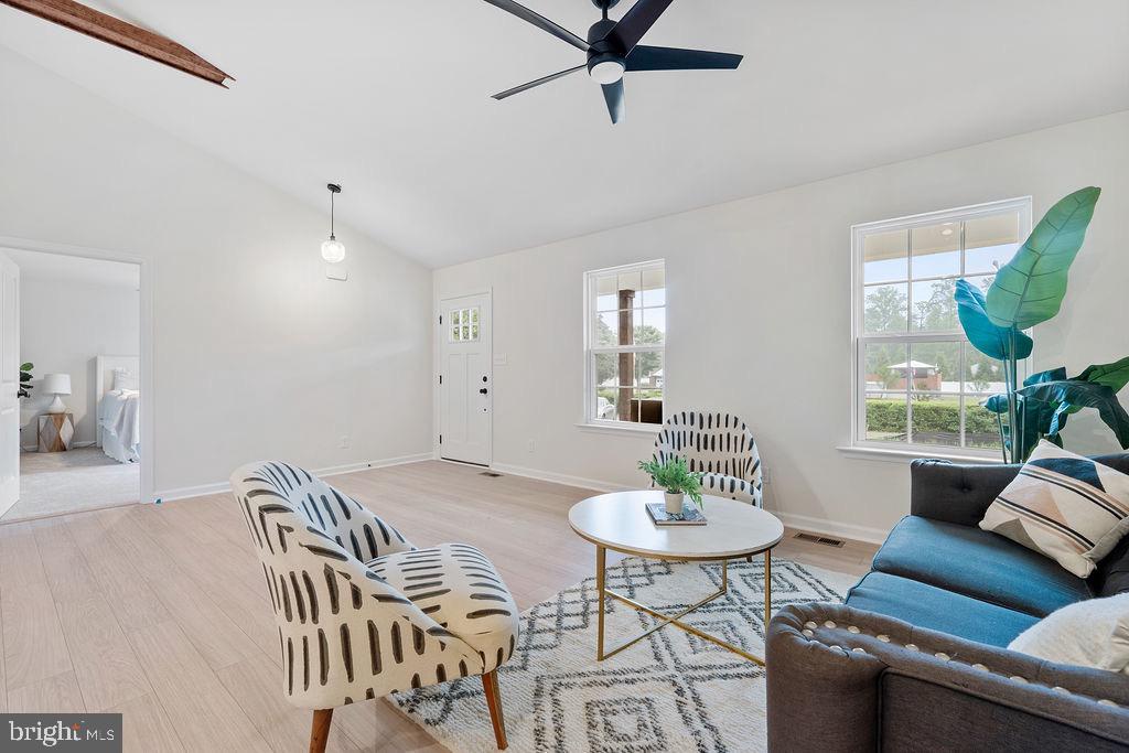 26332 Old Pitts Road Ruther Glen, VA 22546 - Photo 4 of 35 a view of a livingroom and a dining room with furniture window and wooden floor