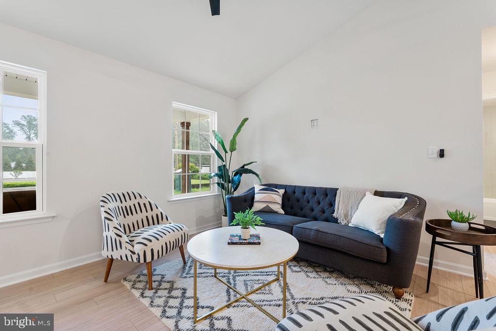 26332 Old Pitts Road Ruther Glen, VA 22546 - Photo 7 of 35 a living room with furniture and a potted plant