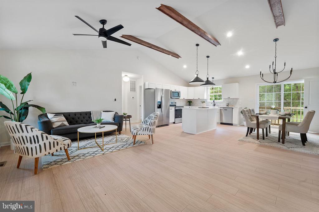 26332 Old Pitts Road Ruther Glen, VA 22546 - Photo 8 of 35 a living room with furniture and a chandelier