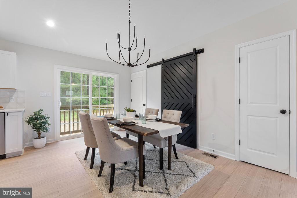 26332 Old Pitts Road Ruther Glen, VA 22546 - Photo 10 of 35 a view of a dining room with furniture window and outside view