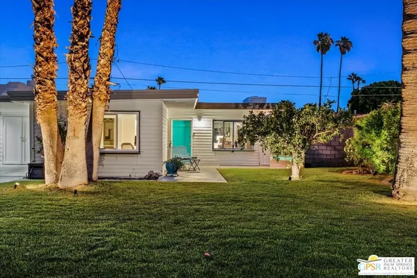 a potted plant sitting in front of a house