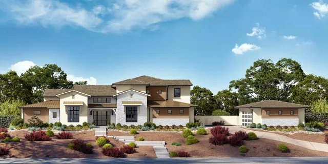 a front view of a building with lots of cars parked