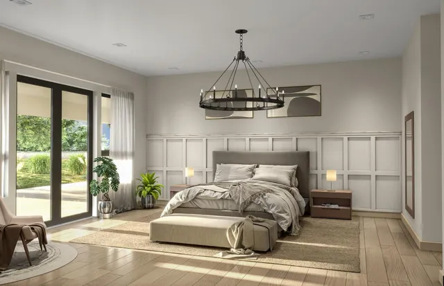 a bedroom with a bed and chandelier