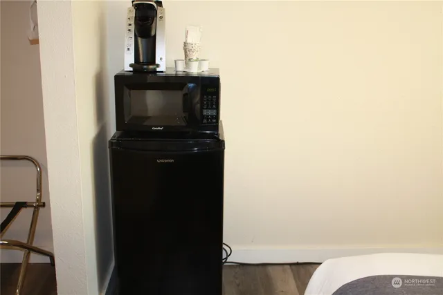 a bedroom with furniture and a window