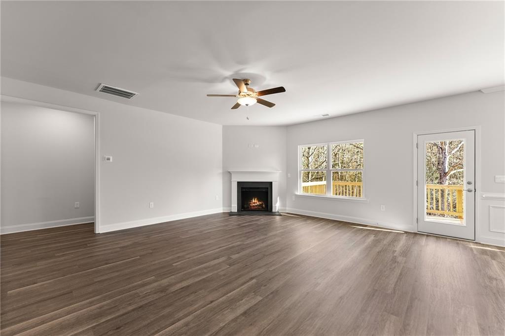642 Bald Ridge Circle Demorest, GA 30535 - Photo 8 of 18 a view of an empty room with window and wooden floor