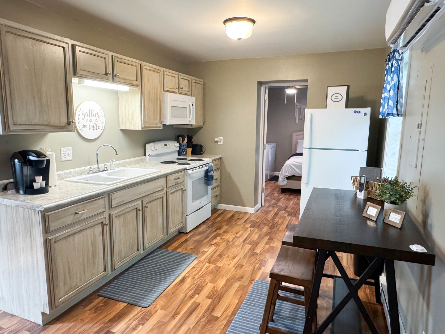 113 Lafayette Street Anna, IL 62906 - Photo 17 of 33 a view of a kitchen area with furniture and wooden floor