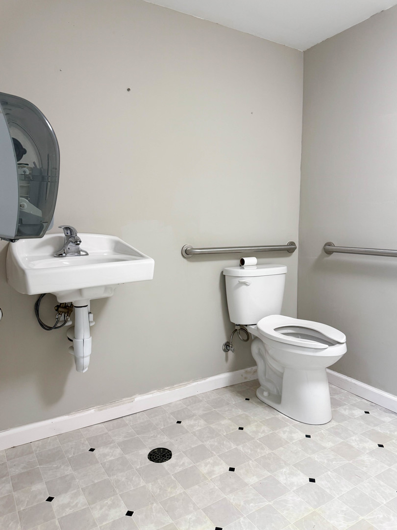 113 Lafayette Street Anna, IL 62906 - Photo 31 of 33 a white toilet sitting next to a bathroom sink