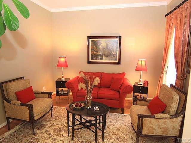 106 Sterling Ridge Way Cary, NC 27519 - Photo 2 of 12 Beautiful formal living room with crown and hardwoods, it would make a great home office as well.