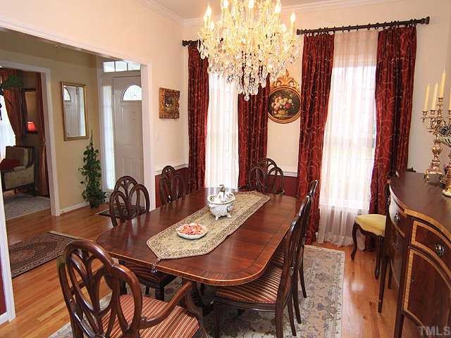 106 Sterling Ridge Way Cary, NC 27519 - Photo 3 of 12 Spacious dining room with chair railing and crown molding.