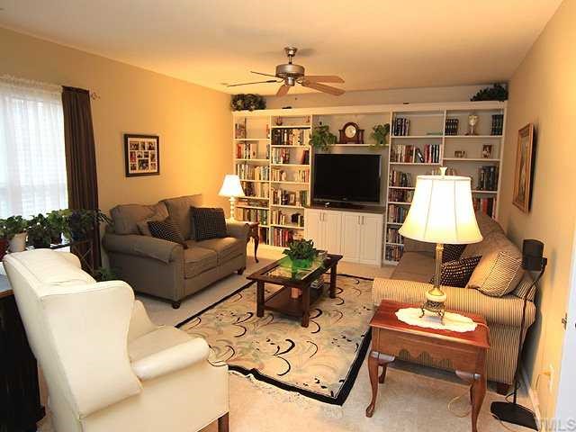 106 Sterling Ridge Way Cary, NC 27519 - Photo 9 of 12 Large bonus room with lots of light and custom-built bookcases.Perfect room for family time/office/theatre room..