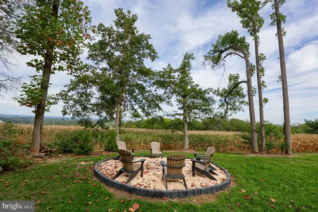 a view of a backyard with wooden fence