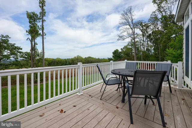 a living room with furniture and a wall painting
