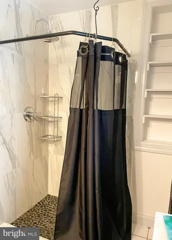 a view of a wooden table and chairs in a room