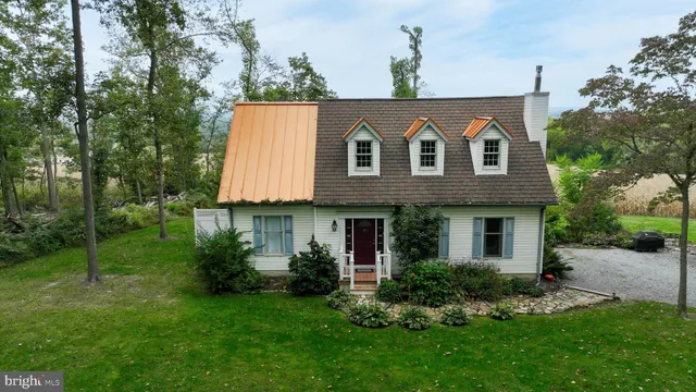 an aerial view of a house with a garden
