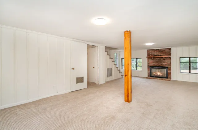 a view of a livingroom with a staircase