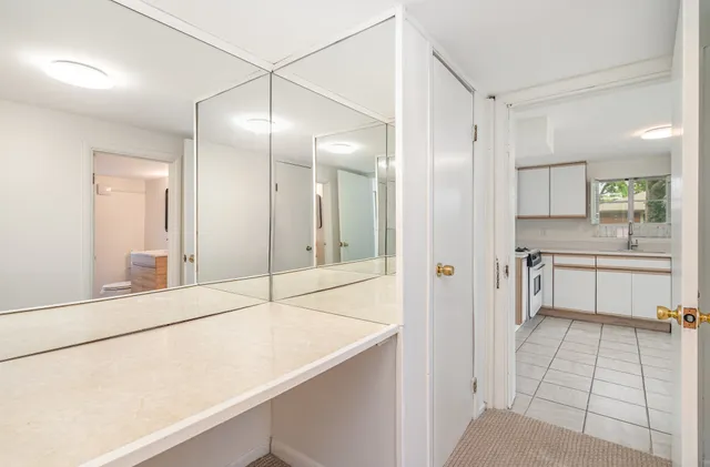 a bathroom with a sink and a large mirror