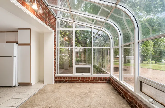 a view of an entryway with a floor to ceiling window