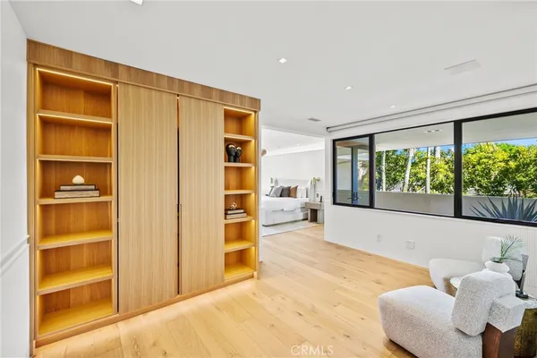 a spacious bedroom with a bed and a window