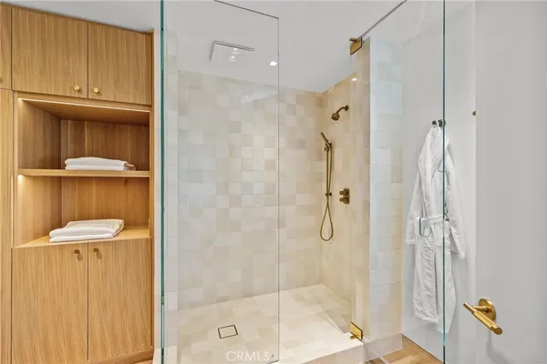 a bathroom with a shower a toilet and a sink