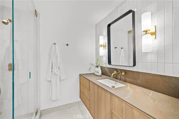 a bathroom with a double vanity sink and mirror