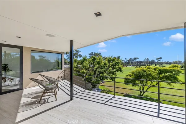a view of a chairs and table in patio