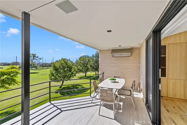 a view of a porch with furniture and yard