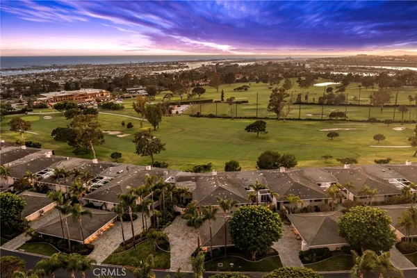 an aerial view of ocean and residential houses