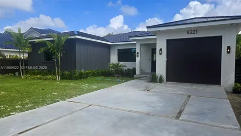 a kitchen with stainless steel appliances a refrigerator and a stove top oven