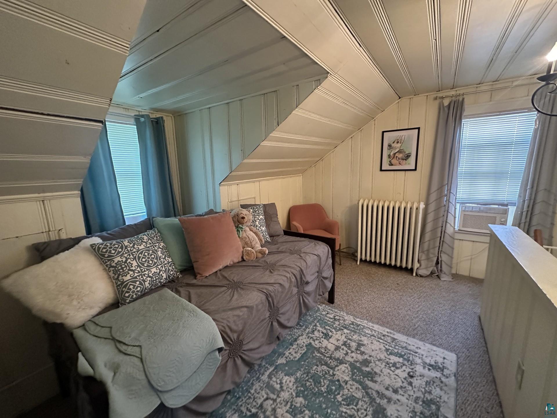 208 Chestnut Street Cloquet, MN 55720 - Photo 21 of 24 Sloped ceiling room featuring plank wall and ceiling finishes