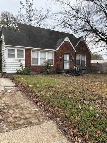 a house with trees in the background